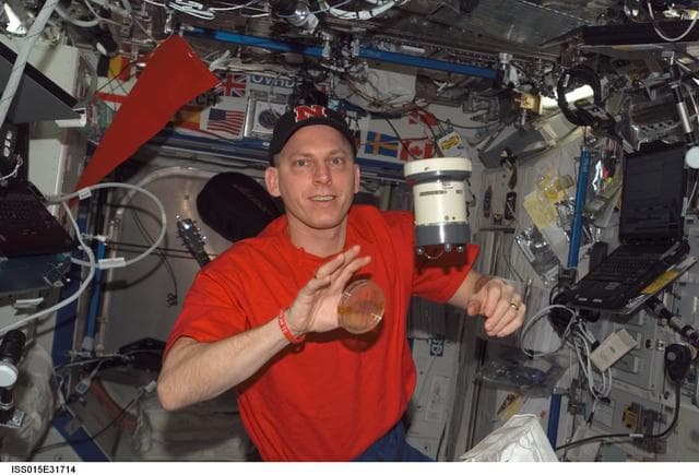 NASA image: Anderson gathers air samples in the US Lab during Expedition 15