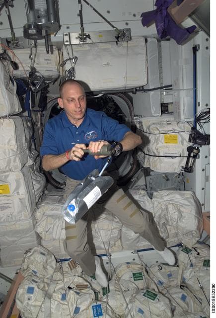 NASA image: View of Expedition 15 FE Anderson performing the ANITA Experiment in the Node 1
