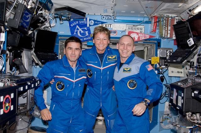 NASA image: Expedition 15 and Expedition 16 Crewmembers pose for a photo in the US Lab