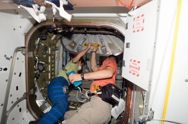 NASA image: Whitson and Nespoli open Node 2 hatch