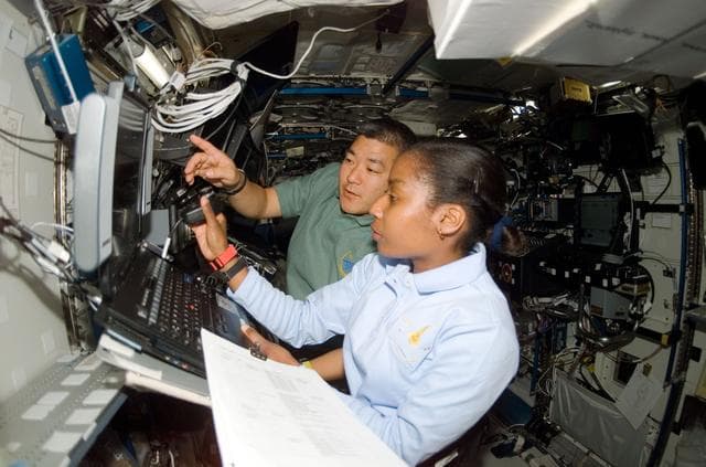 NASA image: Wilson and Tani in the U.S. Lab during Expedition 16/STS-120 joint operations