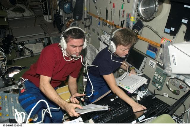 NASA image: Malenchenko and Whitson during docking procedures for Progress 27P Spacecraft