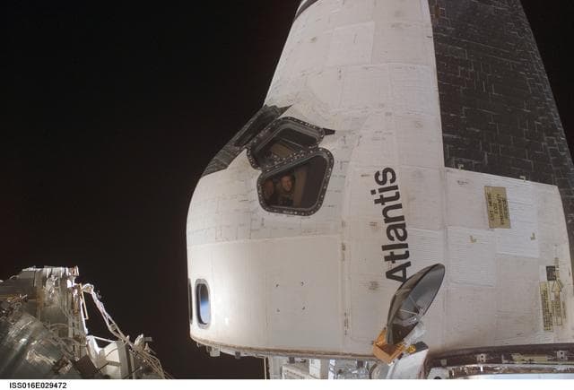 NASA image: Poindexter and Frick on docked Atlantis