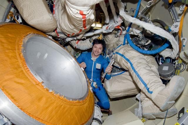 NASA image: Kononenko holds a canister in the Pirs DC1 during Expedition 17