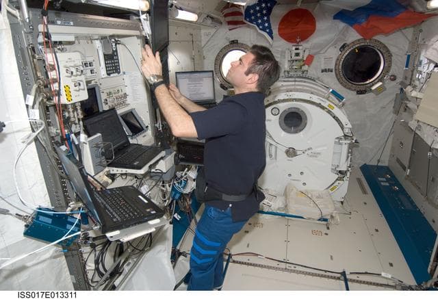 NASA image: Chamitoff works on the JEMRMS in the JEM during Expedition 17