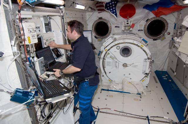 NASA image: Chamitoff works on the JEMRMS in the JEM during Expedition 17