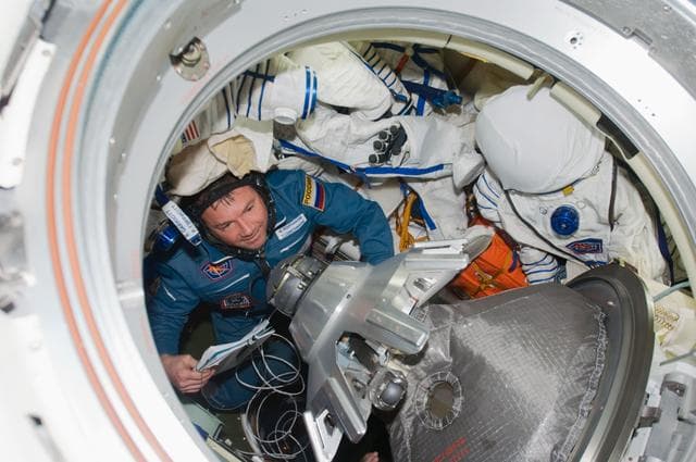 NASA image: Lonchakov ingresses the Earth-facing port of the SM after arrival of the Soyuz TMA-13 Spacecraft