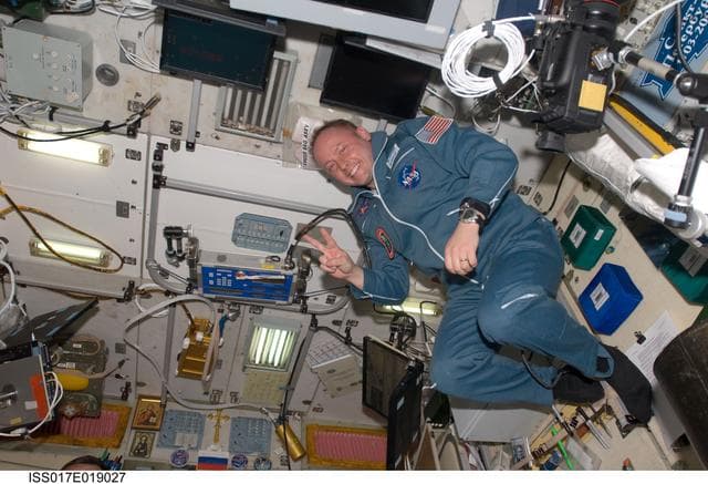 NASA image: Fincke poses for photo in the SM during Joint Operations