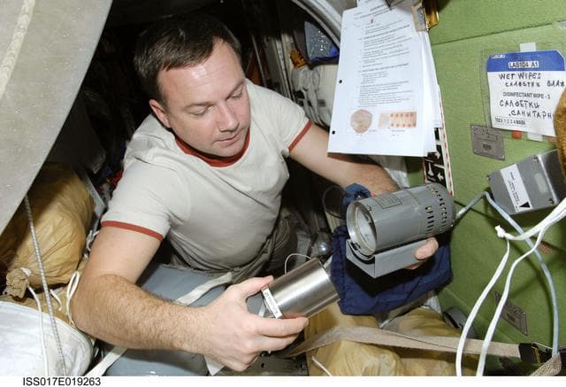 NASA image: Lonchakov works with the BTKh-14/BIOEMULSION during Joint Operations