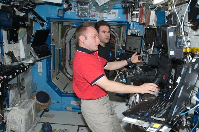 NASA image: ISS Expedition 18 Crew in US Laboratory during Space Station Remote Manipulator System (SSRMS) External Stowage Platform