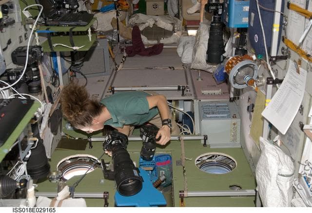 NASA image: ISS Expedition 18 Sandra Magnus in Service Module (SM) with cameras