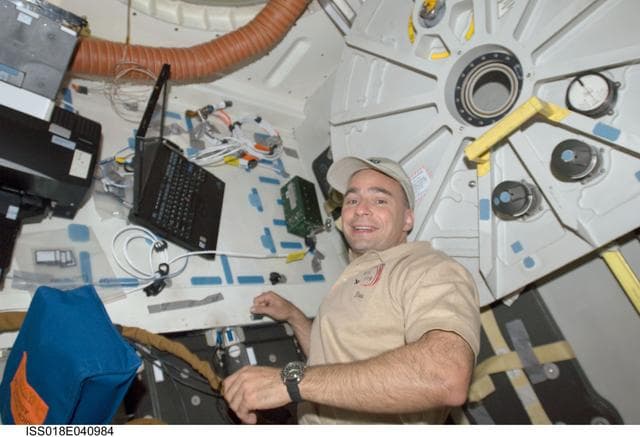 NASA image: Archambault near Shuttle Airlock