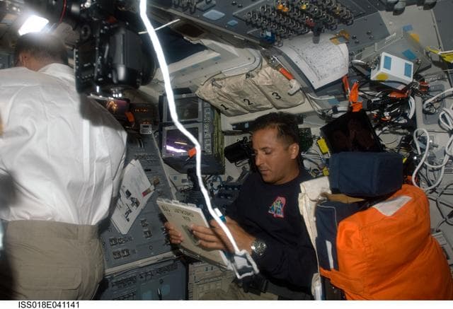 NASA image: Acaba on Flight Deck (FD) during STS-119 Extravehicular Activity (EVA) 1