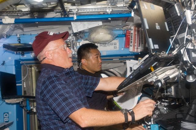 NASA image: Phillips and Wakata at RWS for SSRMS OPS during STS-119 Extravehicular Activity (EVA) 1