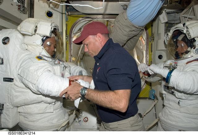 NASA image: STS-119 Extravehicular Activity (EVA) 1 Extravehicular Mobility Unit (EMU) Doff