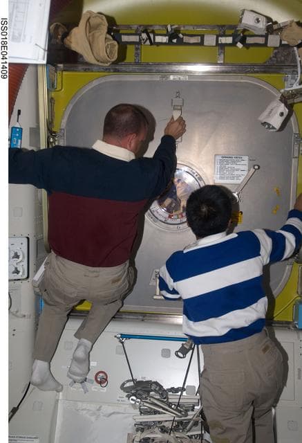 NASA image: STS-119 Extravehicular Activity (EVA) 2 Extravehicular Mobility Unit (EMU) Doff