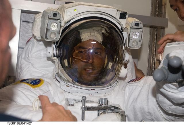 NASA image: STS-119 Extravehicular Activity (EVA) 2 Extravehicular Mobility Unit (EMU) Doff