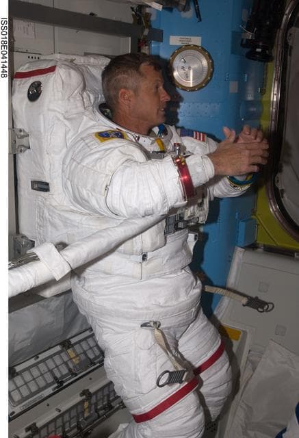 NASA image: STS-119 Extravehicular Activity (EVA) 2 Extravehicular Mobility Unit (EMU) Doff