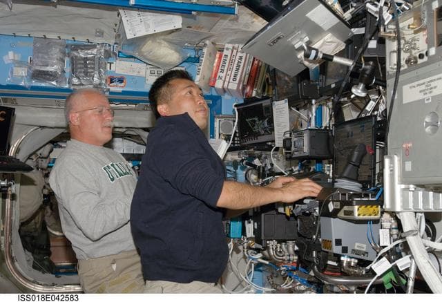 NASA image: Phillips at Robotics Workstation (RWS) during STS-119 Extravehicular Activity (EVA) 3