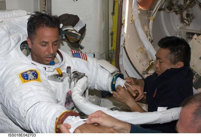 NASA image: Extravehicular Mobility Unit (EMU) Preparations in Joint Airlock Quest