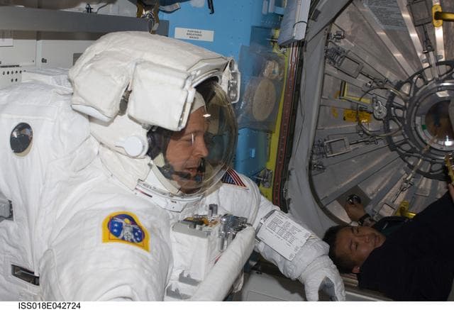 NASA image: Extravehicular Mobility Unit (EMU) Preparations in Joint Airlock Quest