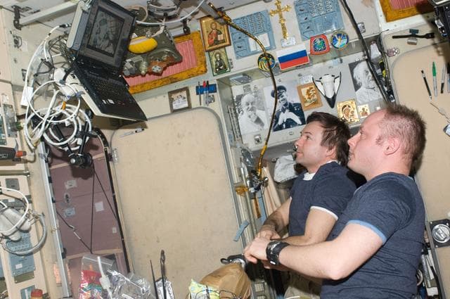 NASA image: Fincke and Lonchakov view Soyuz TMA-14 (18S) Launch on Laptop