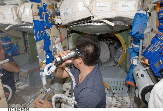 NASA image: Wakata haircut in the Service Module (SM)