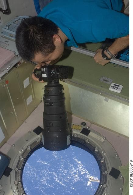 NASA image: Wakata with camera at SM window