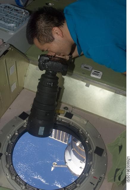 NASA image: Wakata with camera at SM window