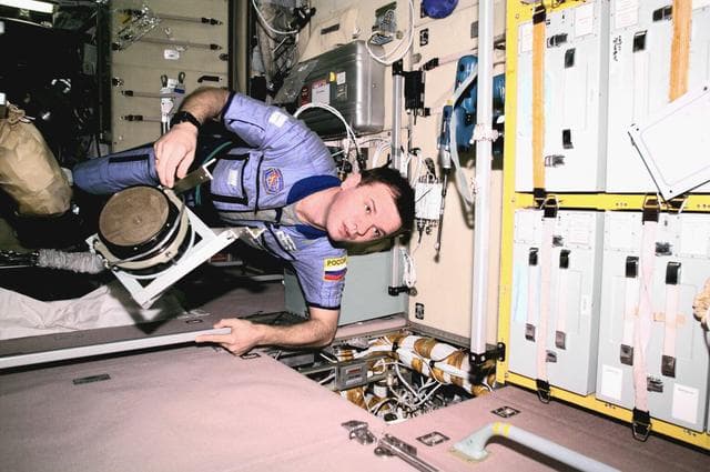 NASA image: Gidzenko in Zvezda Service module with ventilator fan