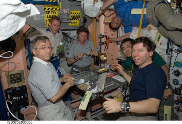 NASA image: Expedition 20 crew during meal