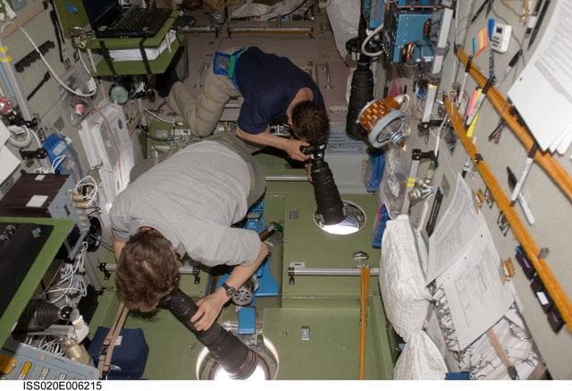 NASA image: Padalka and Romanenko with cameras in SM