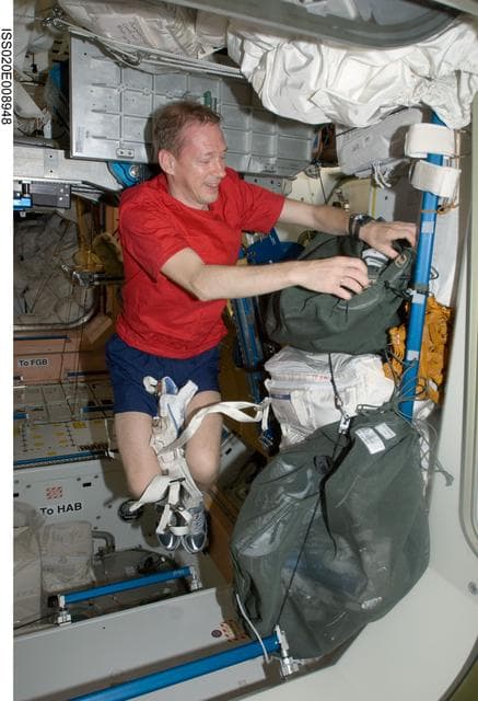 NASA image: De Winne stows exercise equipment in the Node 1