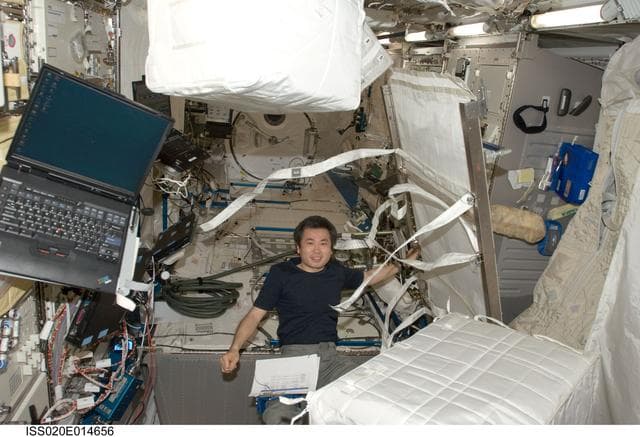 NASA image: Wakata cleaning up the Kibo JPM (JEM Pressurized Module)