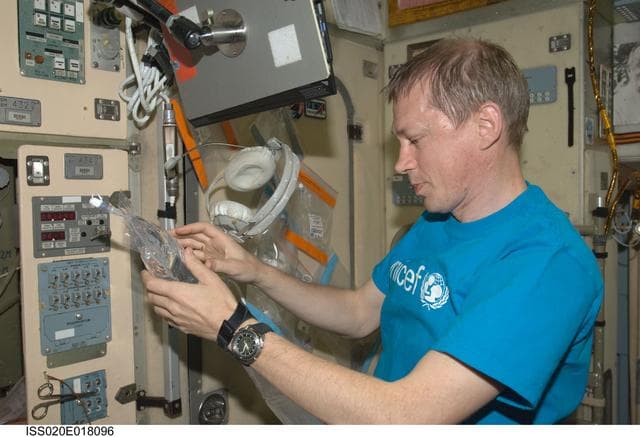 NASA image: De Winne collects water samples in Service Module