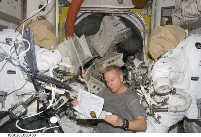 NASA image: Kopra in Airlock with EMUs