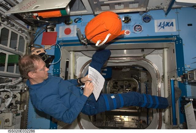 NASA image: De Winne with PFE and PBA equipment in JEM Pressurized Module (JPM)
