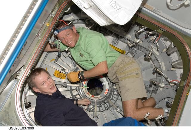 NASA image: Fuglesang and De Winne prepare to enter MPLM