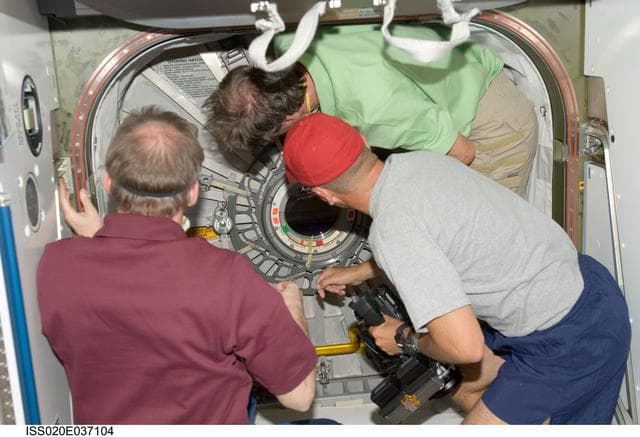 NASA image: Sturckow, Fuglesang and De Winne prepare to enter MPLM