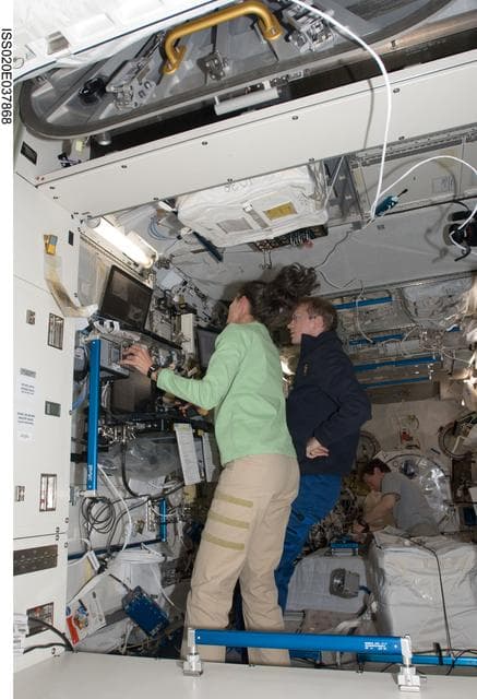NASA image: Stott and De Winne in Kibo with JEM-RMS