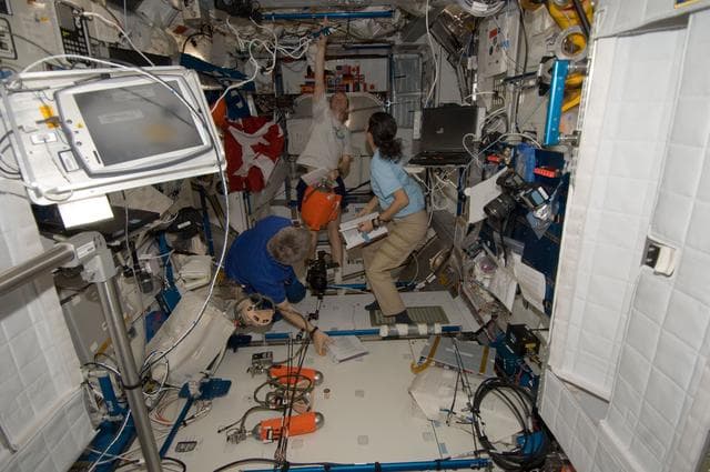 NASA image: Expedition 21 Crew Members participate in Fire Drill/OBT