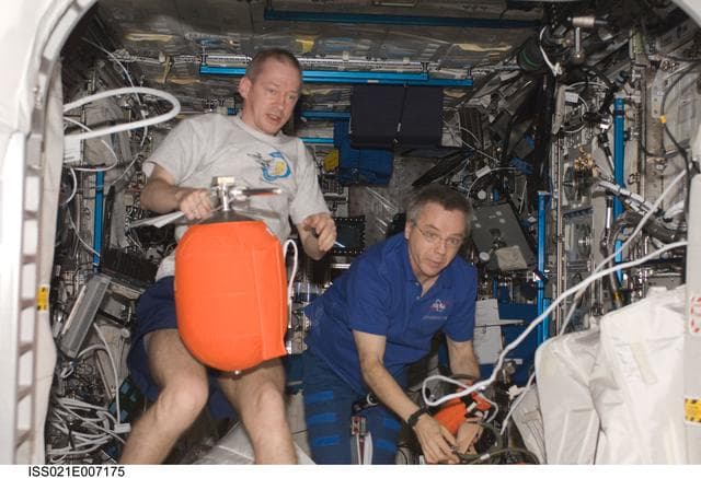 NASA image: Expedition 21 Crew Members participate in Fire Drill/OBT