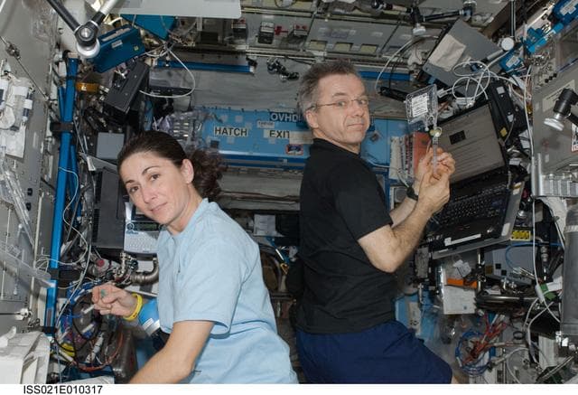 NASA image: FE-4 Thirsk and FE-2 Stott analyze Water Samples in the US Lab
