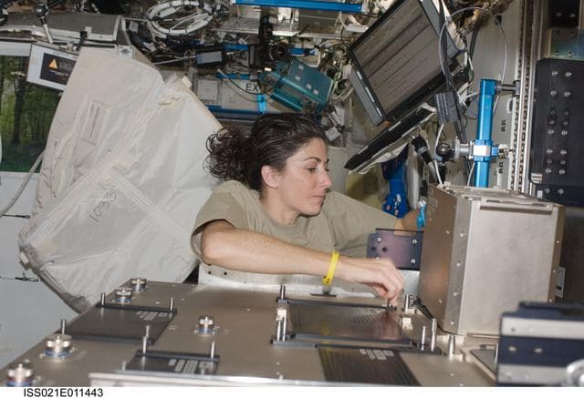 NASA image: View of FE Stott installing hardware on the Fluids Integrated Rack (FIR)