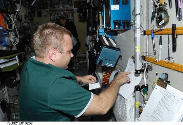 NASA image: FE-1 Suraev prepares a new version of the BIO-5 Rasteniya-2 Experiment
