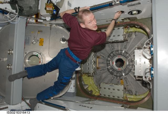 NASA image: View of Commander De Winne floating near the Node 2 Nadir Hatch