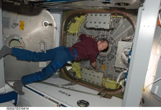 NASA image: View of Commander De Winne floating near the Node 2 Nadir Hatch