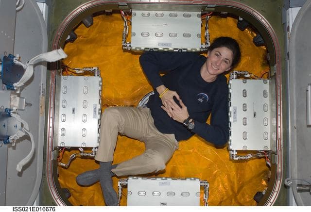 NASA image: FE Stott poses for a photo in front of the Node 2 Nadir Hatch
