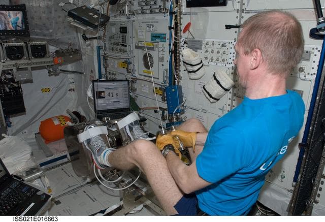 NASA image: Commander De Winne exercises on the FWED in the Columbus Module