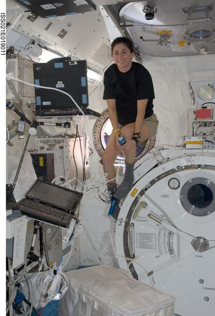 NASA image: Expedition 21 FE Stott poses for a photo in the JPM